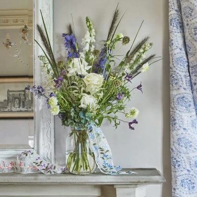 Delphinium and rose vase
