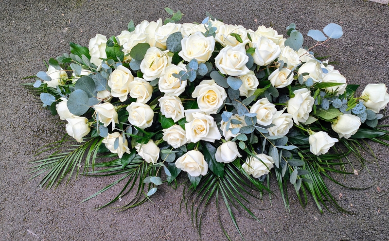 White roses casket spray