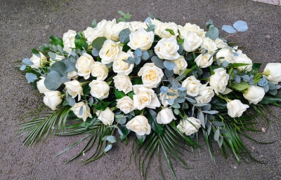 White roses casket spray