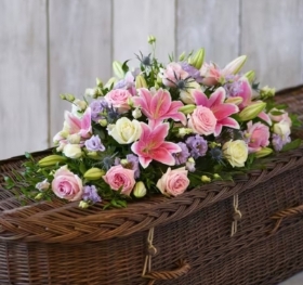 Pink lily and rose casket spray
