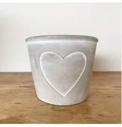 Cement pot white heart outline.