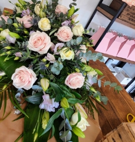 Rose Lilly and Lisianthus casket Spray